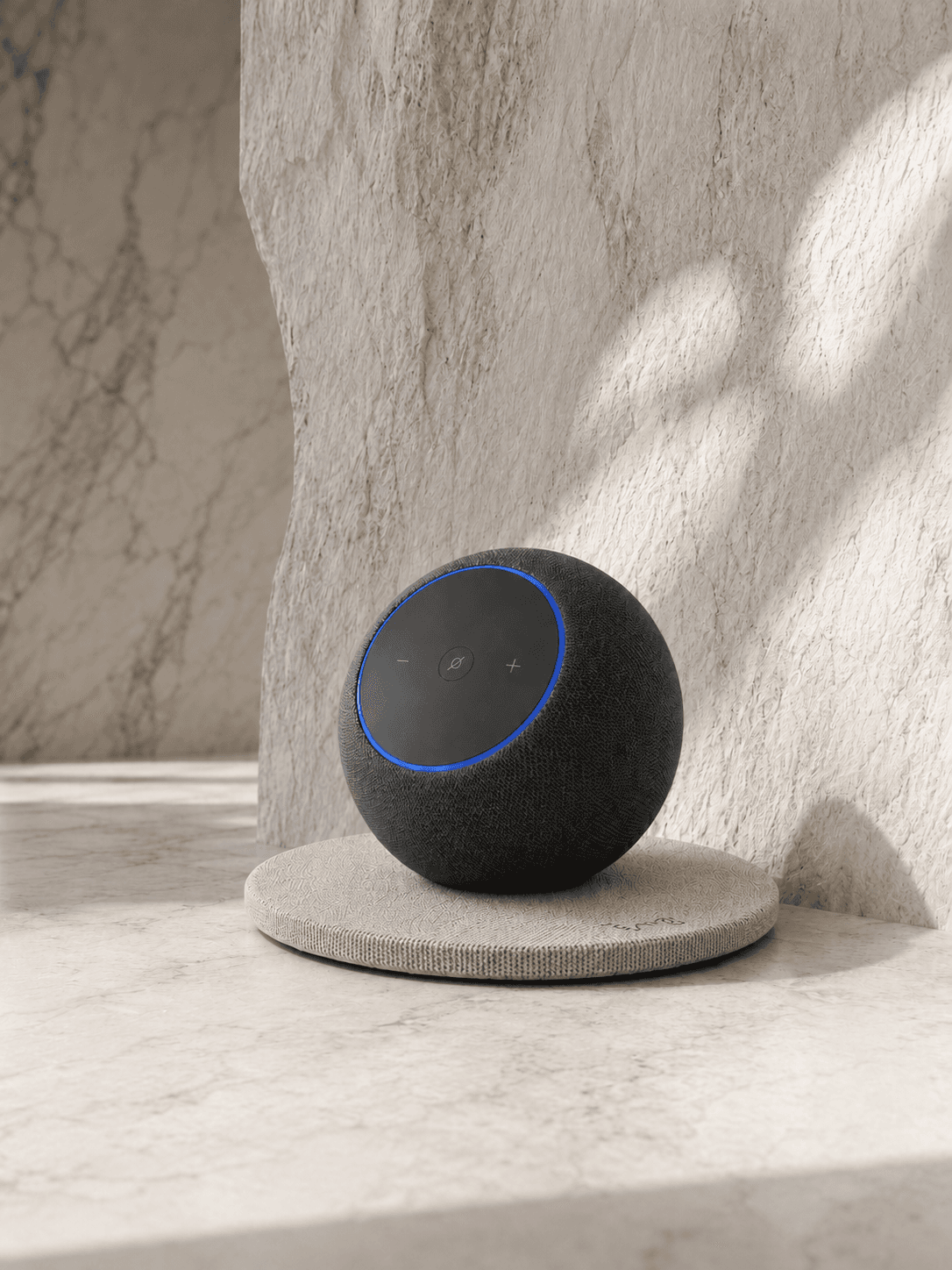 Echo speaker on a round KAIO Speaker Pad