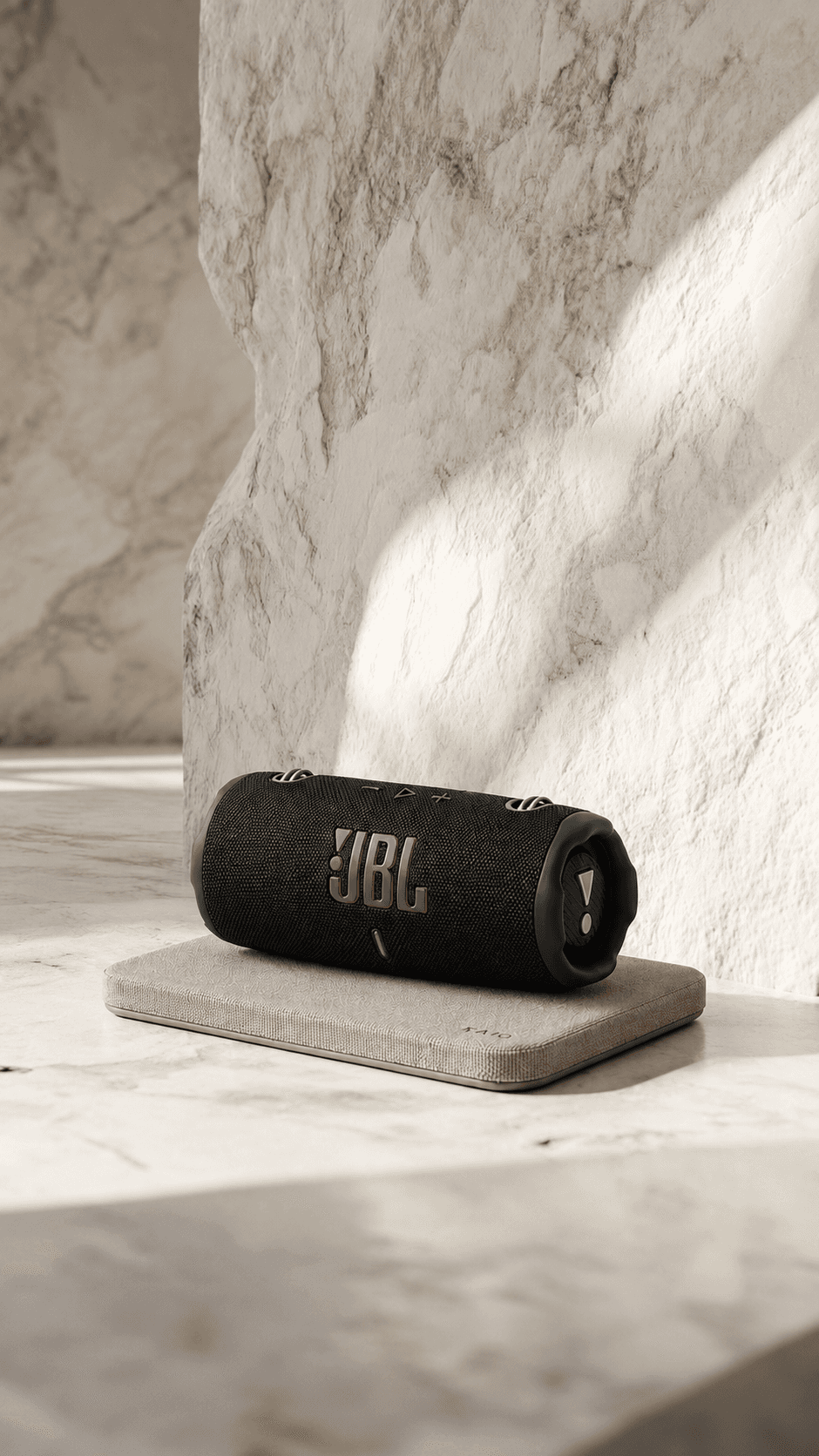 JBL portable speaker on a rectangular KAIO Speaker Pad